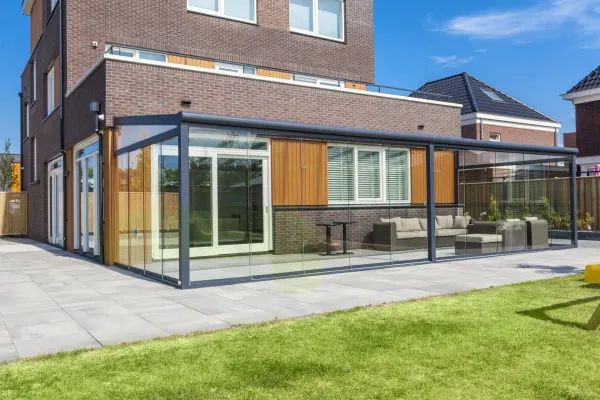 Wall mounted pergola with glass sliding doors in Hertfordshire